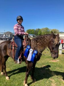 4-H with horse and ribbons
