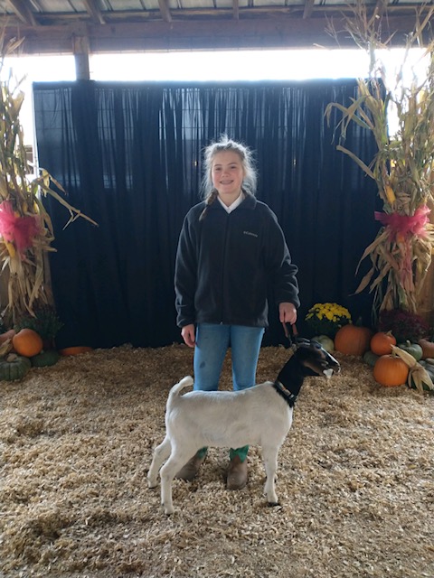 4-H'er with prize winning goat