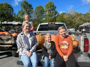Youth participants with their giant pumpkins