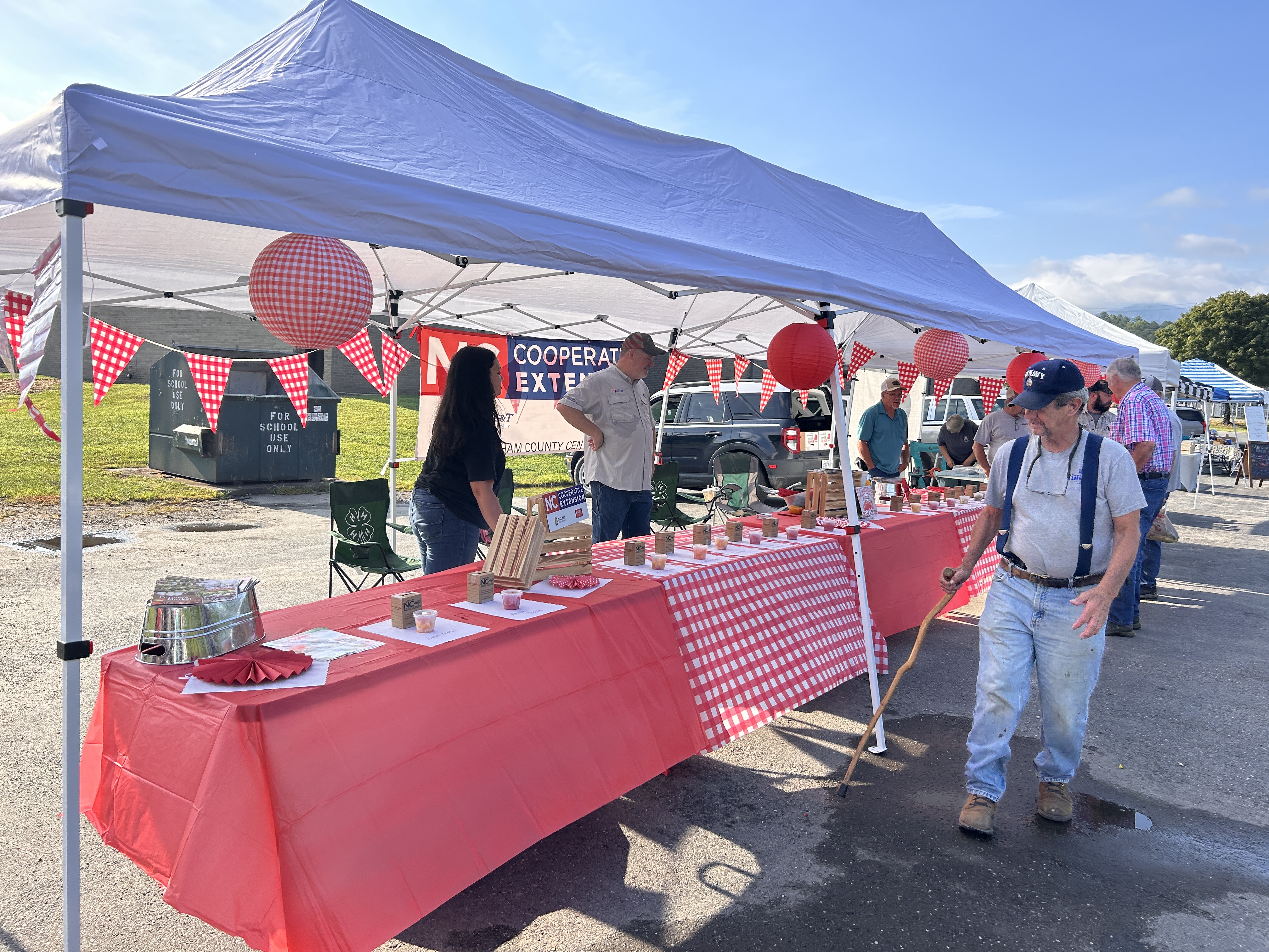 booth at local farmers market for a tomato taste test