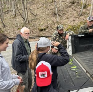 group of 4-H'ers with volunteers learning plant identification